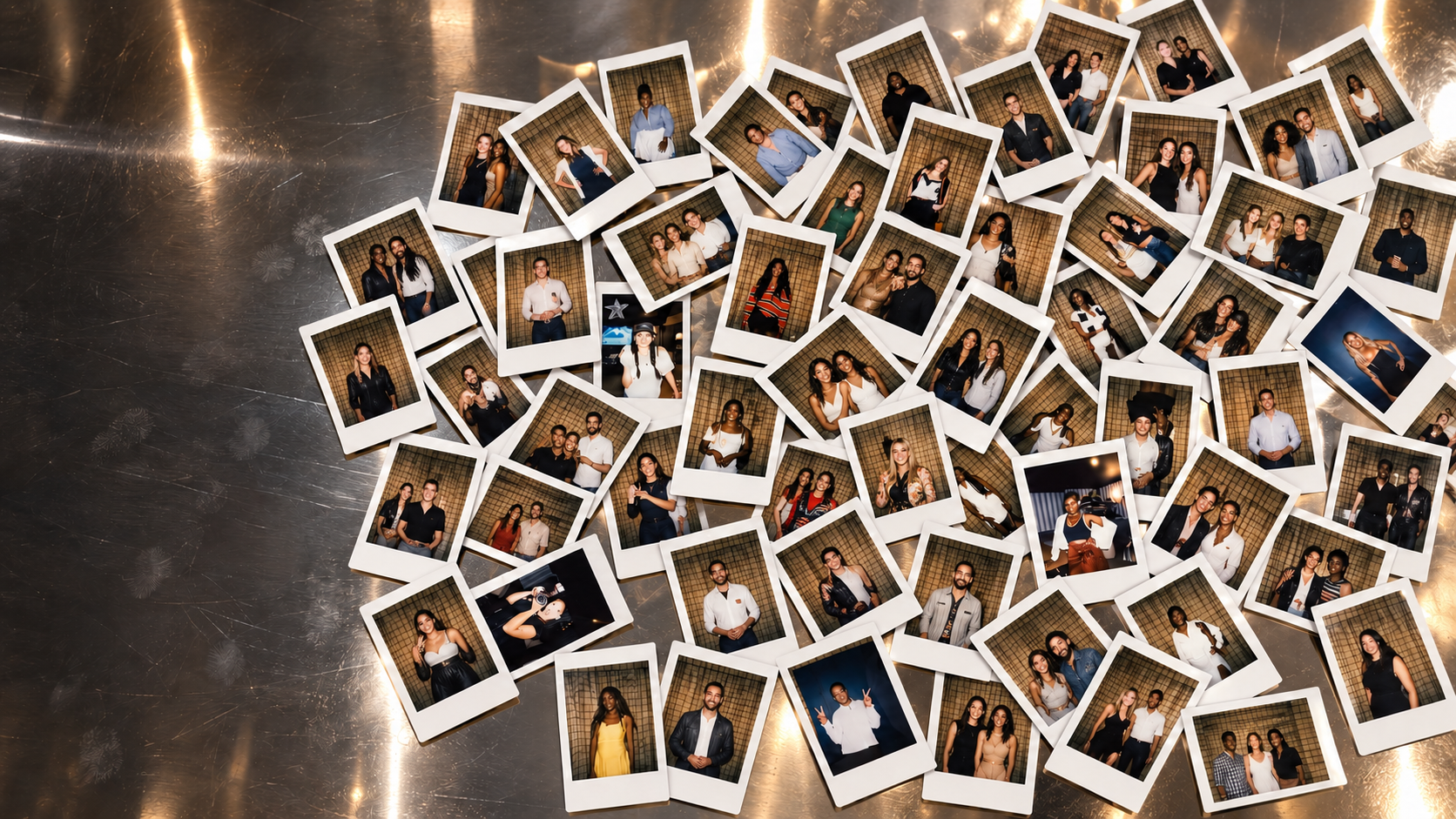 Polaroids scattered across a chrome table at AT THE SET